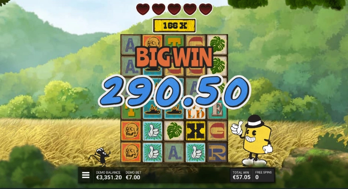 A cartoonish slot game screen with a 5x5 reel grid showing symbols like A, T, skull, leaf, and a yellow character, featuring a