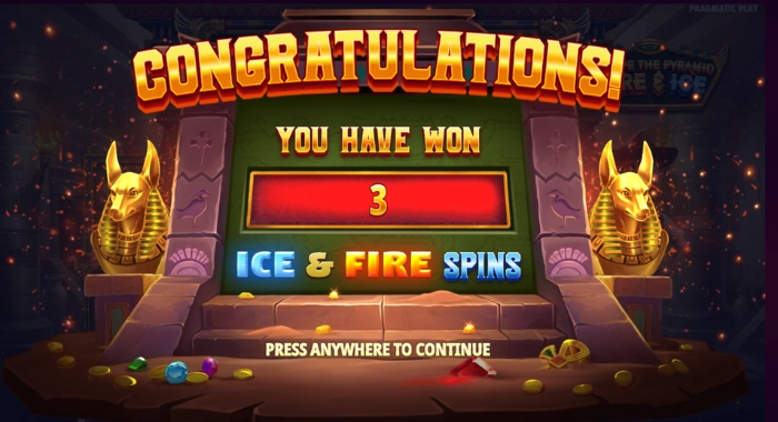 A CONGRATULATIONS message with YOU HAVE WON 3 ICE & FIRE SPINS is displayed on a screen with Egyptian-themed imagery and golden jackal statues.