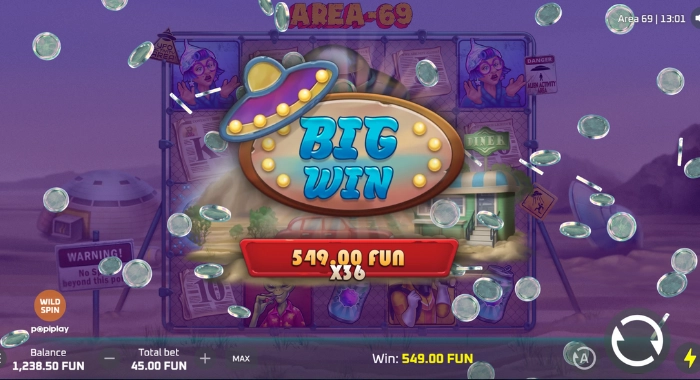 The AREA-69 slot game screen by pepiplay displays a BIG WIN message of 549.00 FUN with a 36x multiplier, alongside a 1,238.50 FUN balance and a 45.00 FUN bet, with a UFO symbol and falling coins animation, set against a desert and UFO background.